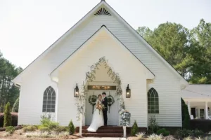 Chloe and Jake infront of Evergreen Chapel