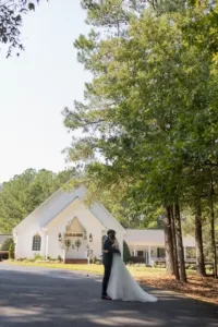 Chloe and Jake infront of chapel pathway