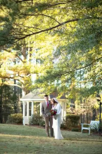 The Bains couple walking near gazebo